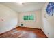 Needs renovation, this bedroom features wood flooring and a window at 3034 Touraine Ave, Orlando, FL 32812