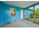 Blue house exterior with screened porch at 3034 Touraine Ave, Orlando, FL 32812