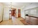 Dining room with tiled floor, wood-paneled walls, and access to kitchen at 3034 Touraine Ave, Orlando, FL 32812