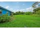 Large grassy backyard with some trees at 3034 Touraine Ave, Orlando, FL 32812