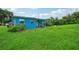 Blue house exterior with grassy yard at 3034 Touraine Ave, Orlando, FL 32812