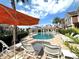 Community swimming pool with lounge chairs for relaxing at 7544 Sunville Ave, Kissimmee, FL 34747