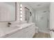 Updated bathroom with white cabinets, quartz countertops, and walk-in shower at 2620 Osceola Bluff Ln, Geneva, FL 32732
