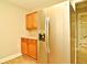 Kitchen area with stainless steel appliances and wood cabinets at 1781 Carlton St, Longwood, FL 32750