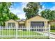 Newly constructed home with attached garage and white picket fence at 1424 18Th St, Orlando, FL 32805