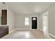 Bright living area with tile floors and an interior door at 1424 18Th St, Orlando, FL 32805