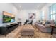 Bright living room with hardwood floors and comfortable seating at 7410 Barrier Cove Way, Kissimmee, FL 34747
