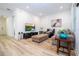 Bright living room with hardwood floors and comfortable seating at 7410 Barrier Cove Way, Kissimmee, FL 34747