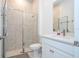 Modern bathroom with a shower and toilet at 7410 Barrier Cove Way, Kissimmee, FL 34747