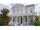 Two-story house with white columns and balcony at 7410 Barrier Cove Way, Kissimmee, FL 34747