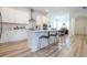 Modern kitchen with white cabinets, stainless steel appliances, and an island at 7410 Barrier Cove Way, Kissimmee, FL 34747