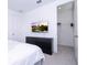 Bedroom with a large TV, dresser, and walk-in closet at 7410 Barrier Cove Way, Kissimmee, FL 34747