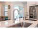Modern kitchen sink and faucet with quartz countertop at 7410 Barrier Cove Way, Kissimmee, FL 34747