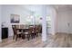 Bright dining room features a six-chair table, and wood floors at 7410 Barrier Cove Way, Kissimmee, FL 34747