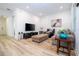 Bright living room with hardwood floors and comfortable seating at 7410 Barrier Cove Way, Kissimmee, FL 34747