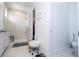 Bathroom with walk-in shower, toilet, and additional storage at 7410 Barrier Cove Way, Kissimmee, FL 34747