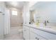 Clean bathroom with double vanity, marble tile, and bathtub at 7410 Barrier Cove Way, Kissimmee, FL 34747