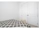 Bedroom with a queen bed and double doors at 7410 Barrier Cove Way, Kissimmee, FL 34747