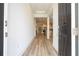 Bright and spacious entryway with light wood floors, leading to the kitchen and living areas at 7410 Barrier Cove Way, Kissimmee, FL 34747