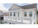 White balcony with railing overlooking neighborhood at 7410 Barrier Cove Way, Kissimmee, FL 34747