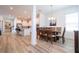 Elegant dining room with a wood table and chairs, adjacent to the kitchen at 7410 Barrier Cove Way, Kissimmee, FL 34747