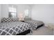 Bedroom with two twin beds and neutral decor at 7410 Barrier Cove Way, Kissimmee, FL 34747