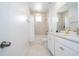 Modern bathroom with a double vanity and a shower/tub combo at 7410 Barrier Cove Way, Kissimmee, FL 34747