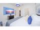 King-size bed, large TV and en-suite bathroom at 4498 Monado Dr, Kissimmee, FL 34746