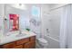 Clean bathroom with a tub, toilet, sink, and vanity at 4498 Monado Dr, Kissimmee, FL 34746