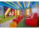 Fun game room with Mario theme, theater seating, and arcade games at 4498 Monado Dr, Kissimmee, FL 34746