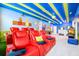 Game room boasts multiple seating options and video game consoles at 4498 Monado Dr, Kissimmee, FL 34746