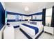 Blue and white themed bedroom with king-size bed at 4498 Monado Dr, Kissimmee, FL 34746