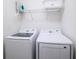 Bright laundry room, complete with washer, dryer, and ample shelving at 4498 Monado Dr, Kissimmee, FL 34746