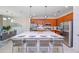 Modern kitchen with large island, stainless steel appliances, and wood cabinets at 4498 Monado Dr, Kissimmee, FL 34746
