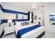 Blue and white themed bedroom with king-size bed at 4498 Monado Dr, Kissimmee, FL 34746