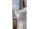 Elegant staircase with modern light fixture and entry door at 837 Desert Mountain Ct, Reunion, FL 34747