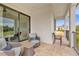 Spacious balcony with sliding glass doors and outdoor seating at 837 Desert Mountain Ct, Reunion, FL 34747