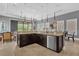 Modern kitchen with a large island, stainless steel appliances and plenty of cabinet space at 837 Desert Mountain Ct, Reunion, FL 34747