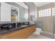 Modern bathroom with a large vanity and shower at 837 Desert Mountain Ct, Reunion, FL 34747