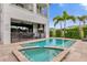 Relaxing pool and spa area with outdoor kitchen at 837 Desert Mountain Ct, Reunion, FL 34747