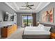 Main bedroom with king bed and balcony access at 837 Desert Mountain Ct, Reunion, FL 34747