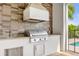 High-end outdoor grill with stainless steel appliances at 837 Desert Mountain Ct, Reunion, FL 34747