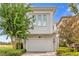 Modern home with stone accents and two-car garage at 837 Desert Mountain Ct, Reunion, FL 34747