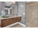 Bathroom with floating vanity and walk-in shower at 837 Desert Mountain Ct, Reunion, FL 34747