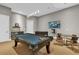 Game room with pool table, foosball, and a TV at 837 Desert Mountain Ct, Reunion, FL 34747