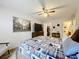 Serene bedroom with a king-size bed, large artwork, and walk-in closet at 100 E Oak Terrace Dr # G1, Leesburg, FL 34748