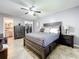 Primary bedroom with king bed and en-suite bath access at 100 E Oak Terrace Dr # G1, Leesburg, FL 34748