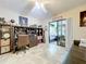Bright home office with built-in shelving, desk, and access to a sunroom at 100 E Oak Terrace Dr # G1, Leesburg, FL 34748