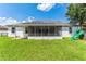 Backyard with solar panels and screened patio at 4901 Culdesac Ct, St Cloud, FL 34772