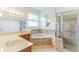 Bathroom with corner tub, shower, and double vanity at 4901 Culdesac Ct, St Cloud, FL 34772